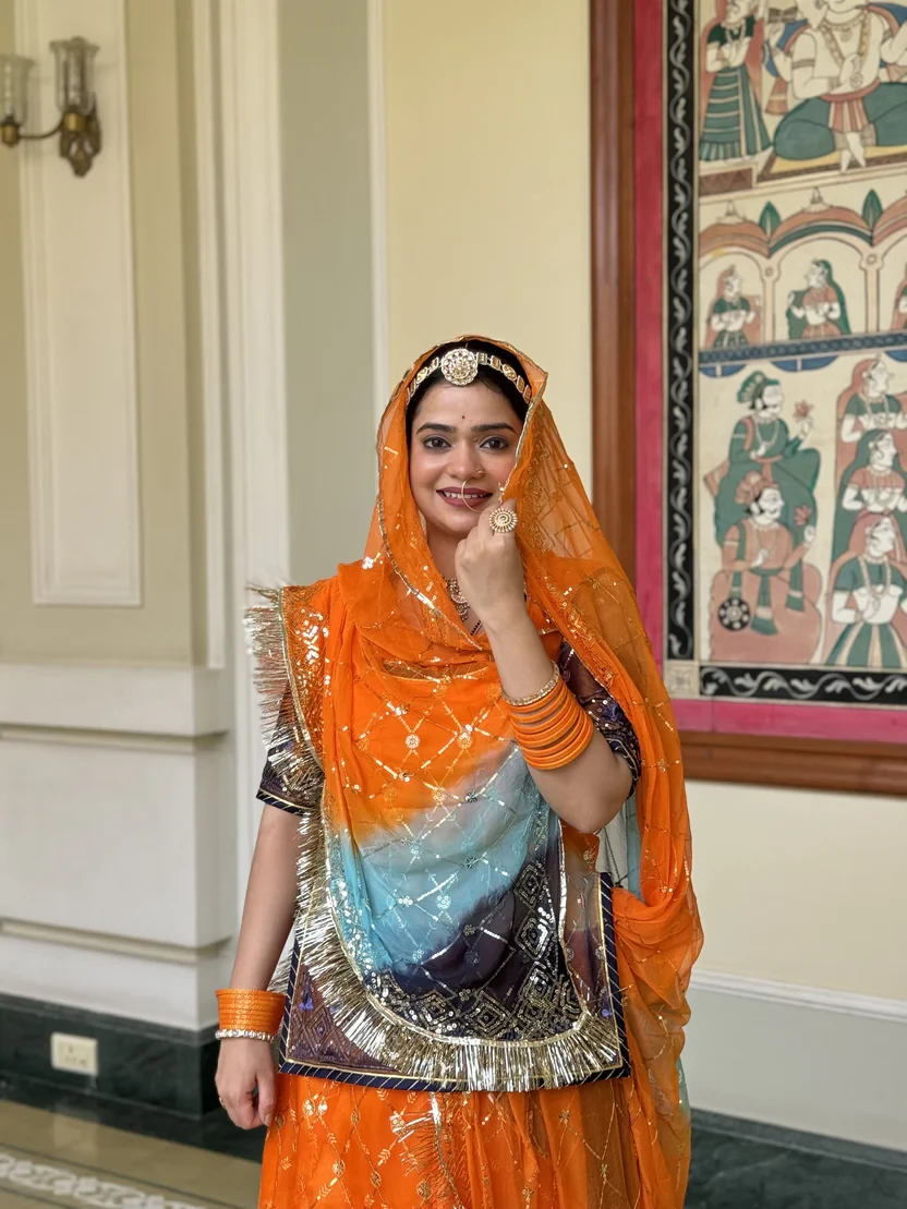 Orange Rajputi Poshak with a Touch of Blue Ethinic Lehanga
