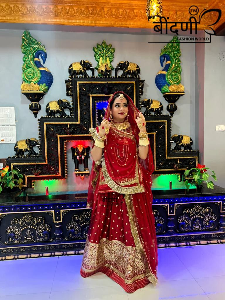 Royal Crimson: The Silk Satin Red Poshak Adorned with Golden Sequins(semi stich)