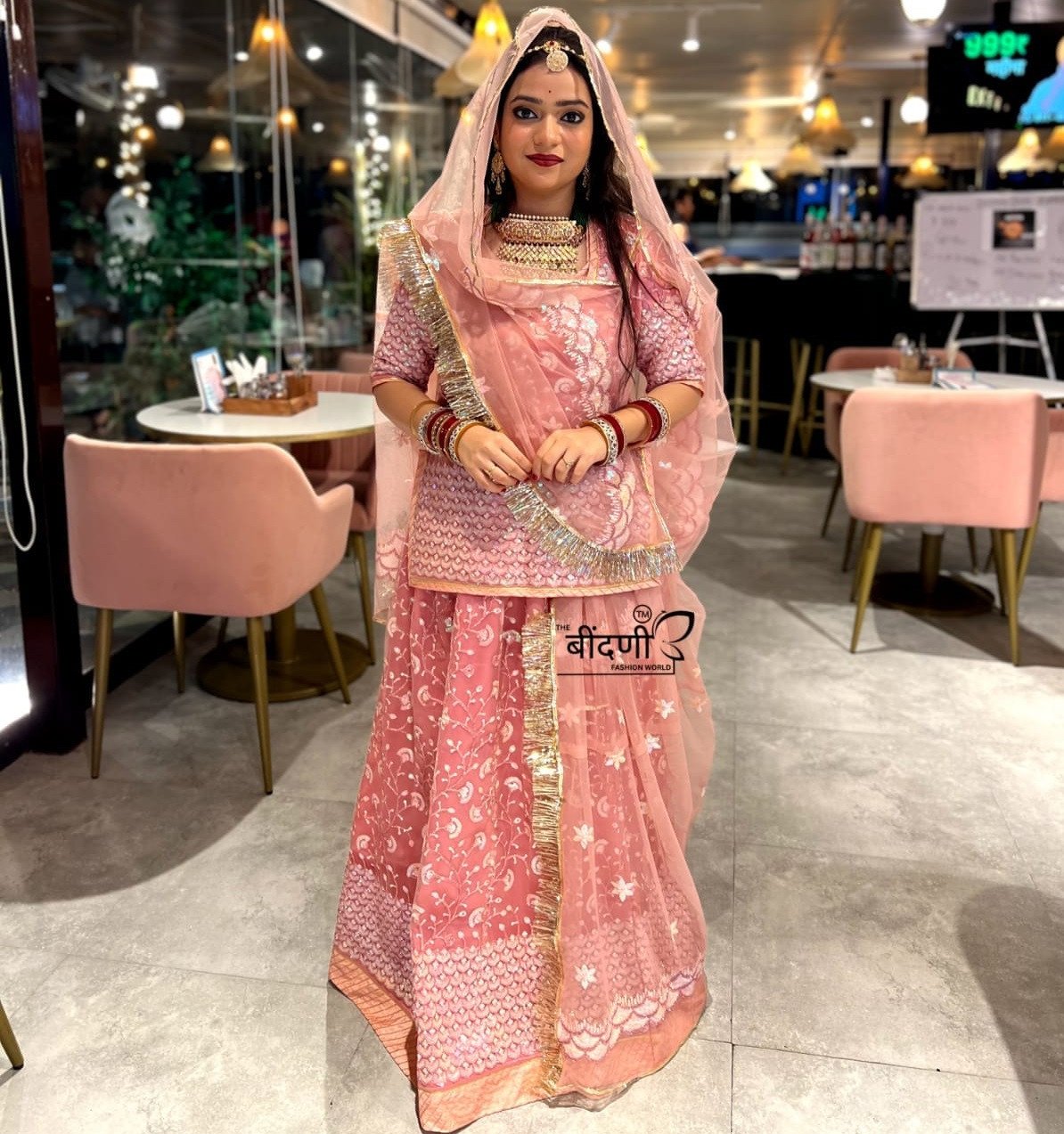 Blushing Elegance: Pink Net Poshak with Sheer Net Odhna(Semi stich)